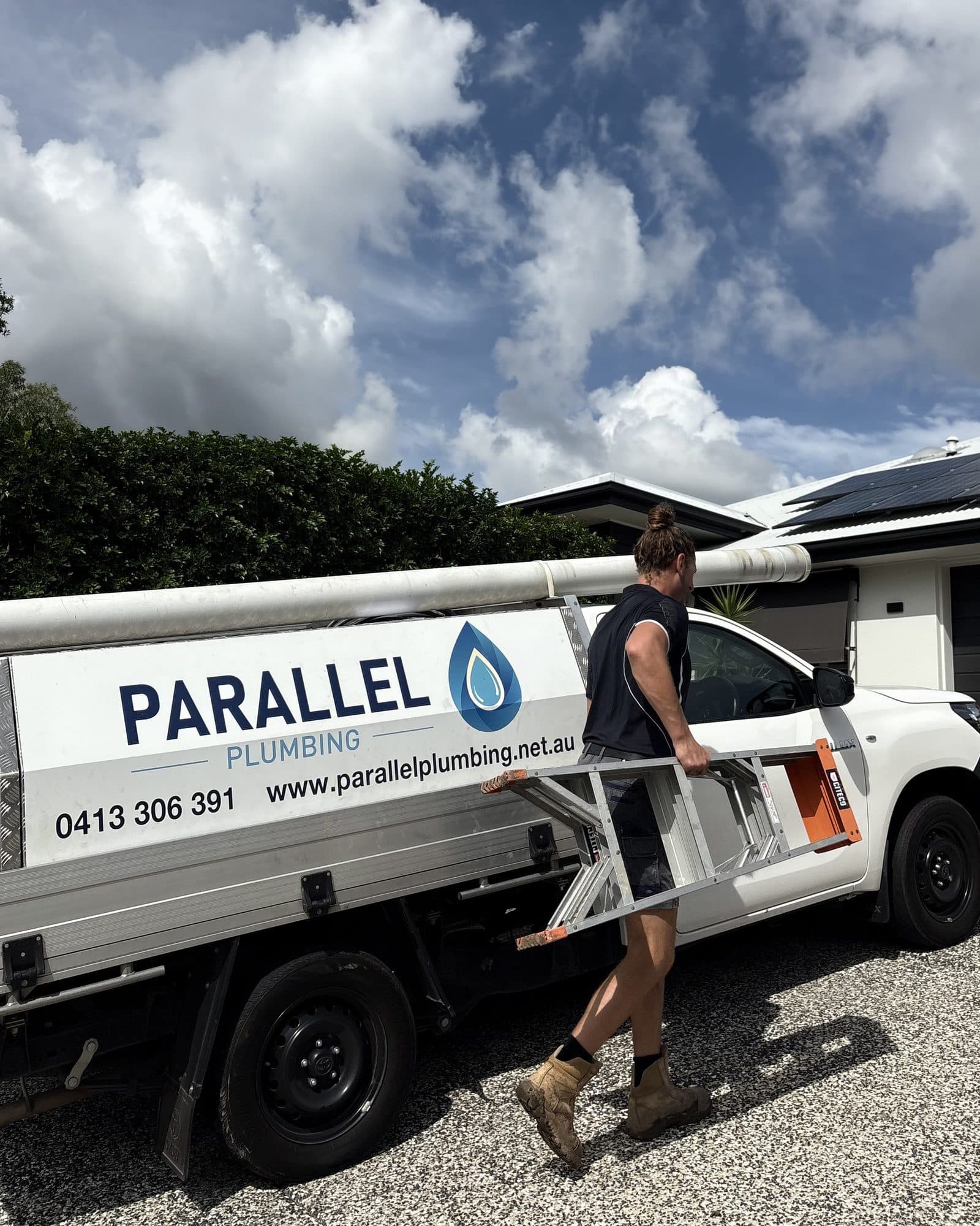 Rusty, owner-operator of Parallel Plumbing, with his branded service van